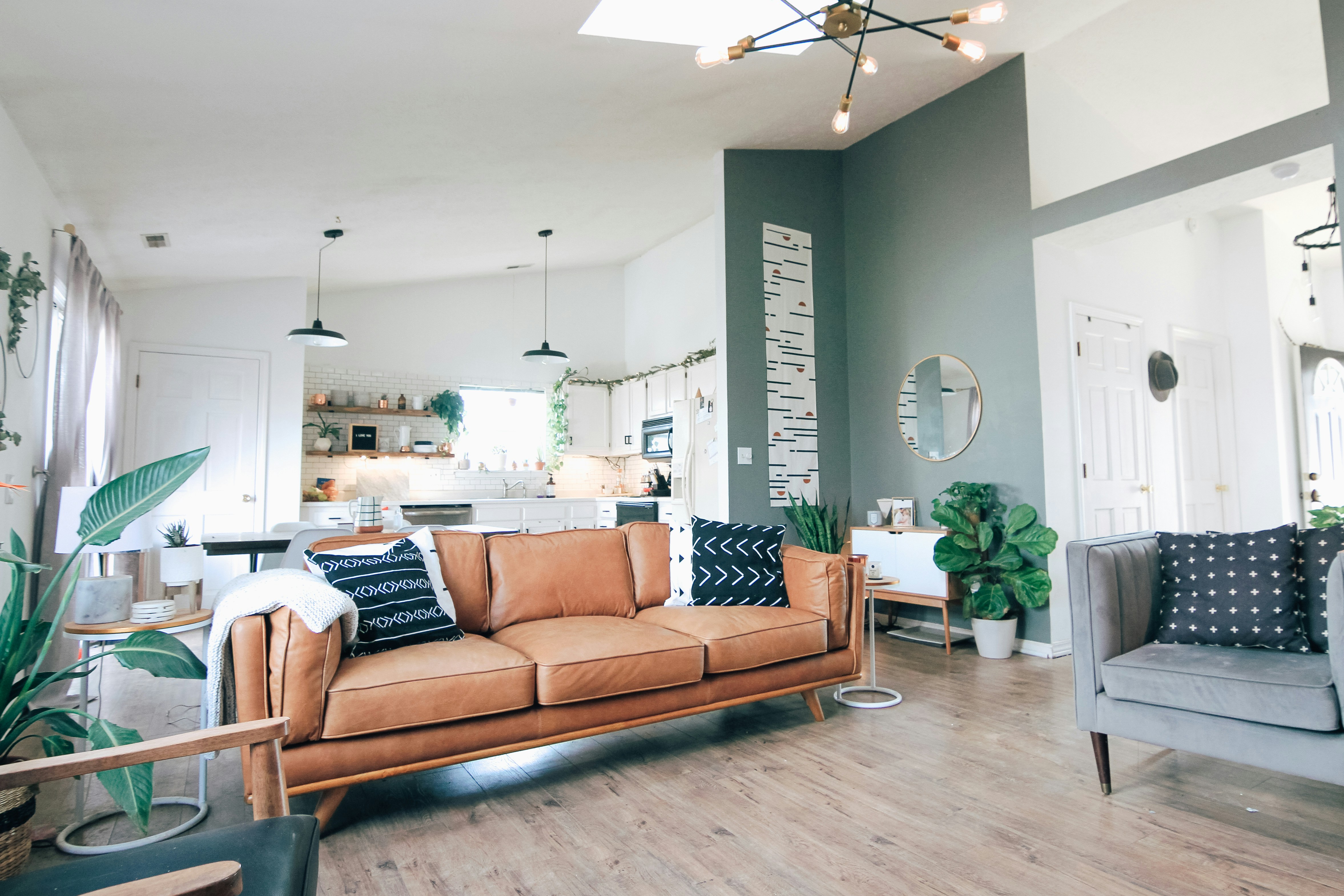 Modern residential building with large windows and landscaped surroundings, bright and welcoming atmosphere